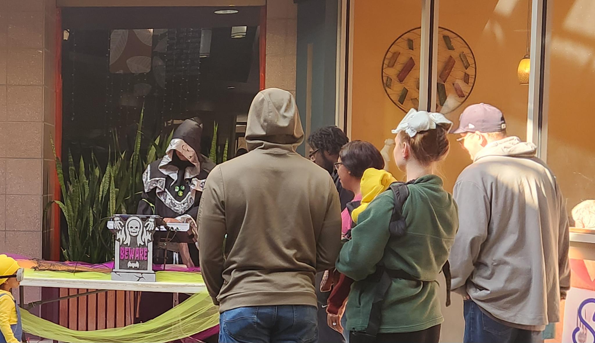 Visitors gathering around Lakeland Cabaret’s DJ booth during Malloween.