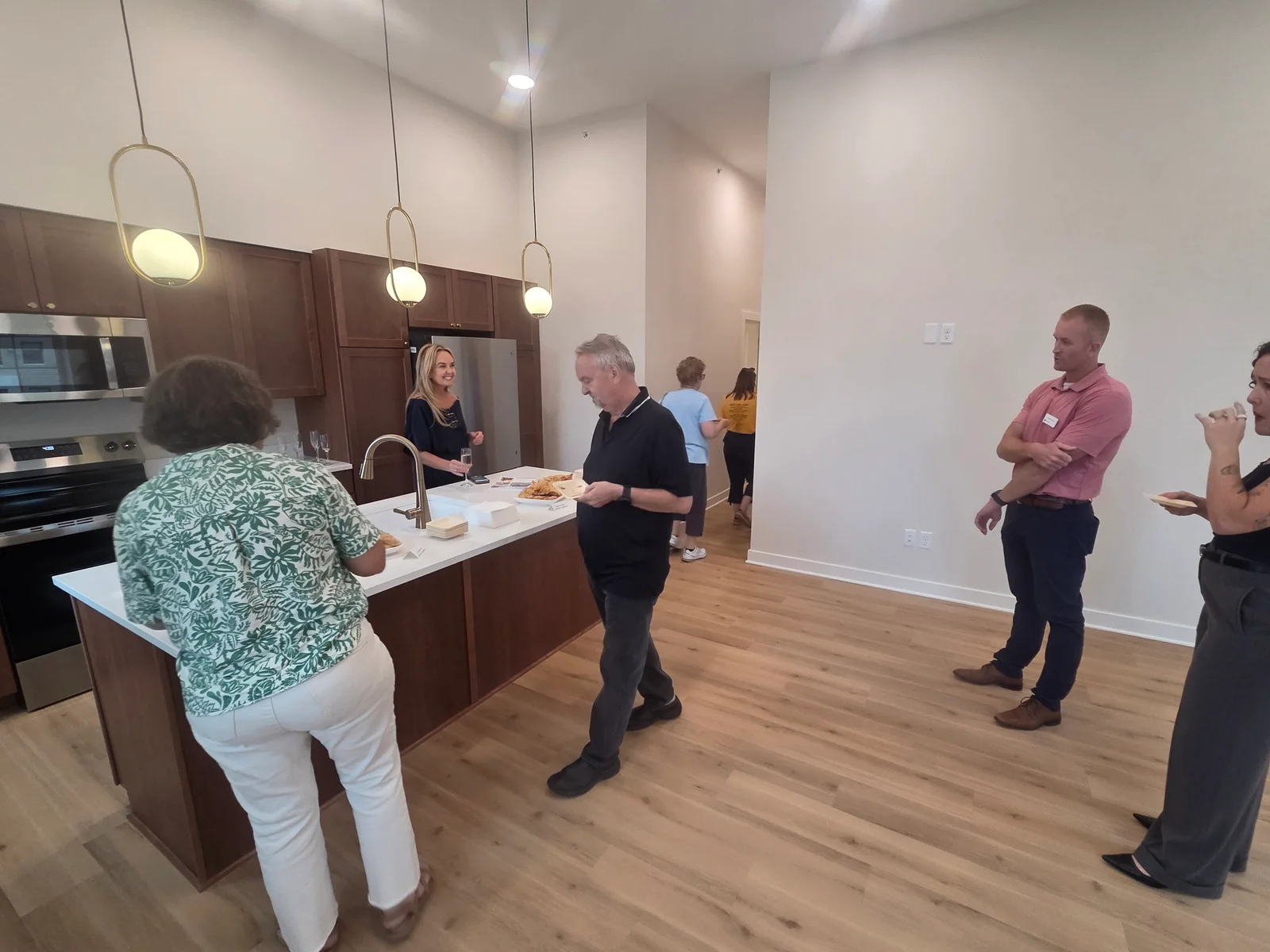 Food and conversation in the apartment kitchen.